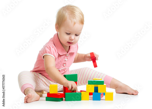 kid girl playing toy blocks...