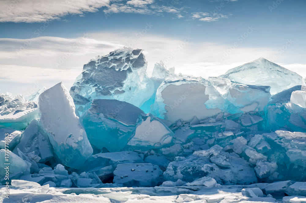 Endless blue ice hummocks in winter on the frozen Lake Baikal