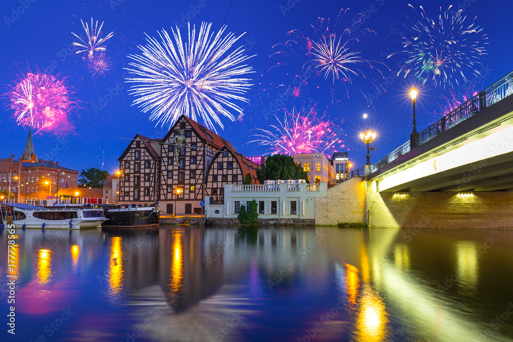 New Years firework display in Bydgoszcz city over Brda river, Poland - obrazy, fototapety, plakaty 