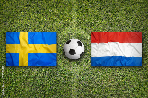 Sweden vs. Netherlands flags on soccer field