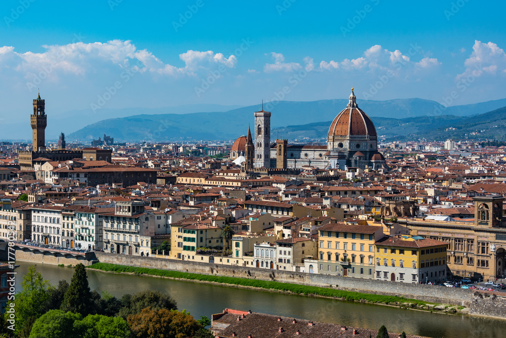 Arno river and rooftops in Florence surrounding The Duomo.