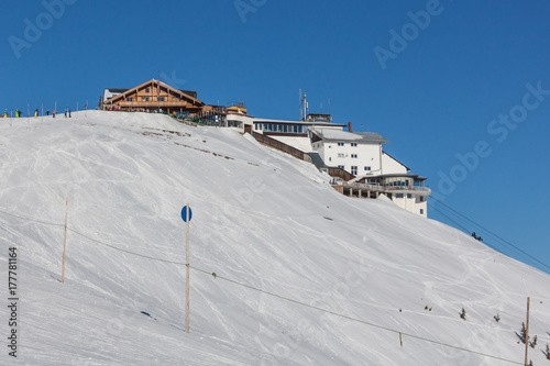 Ski station at the mountain peak on Zell am See ski resort on blue sky background, Austria