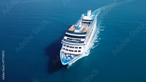 Cruise ship sailing across The Mediterranean sea - Aerial footage photo