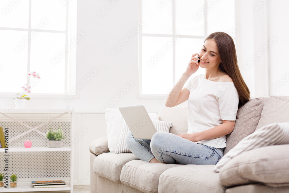 Freelancer working at home with laptop and mobile Freelancer working at home with laptop and mobile