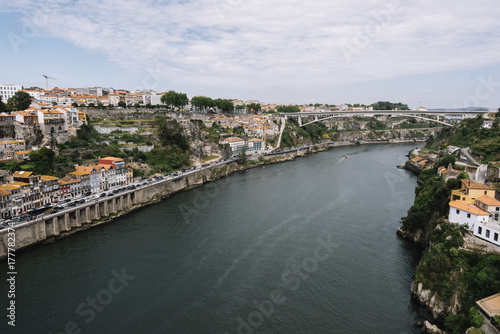 Beautiful panoramic view on Porto's historic venter and Dom Luís I Bridge with river Douro © anastasianess