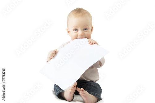 Infant child holding empty board, studio shot