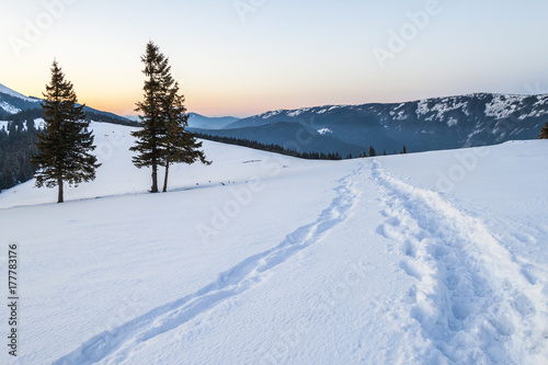Beautiful winter landscape in the mountains with snow path in steppe