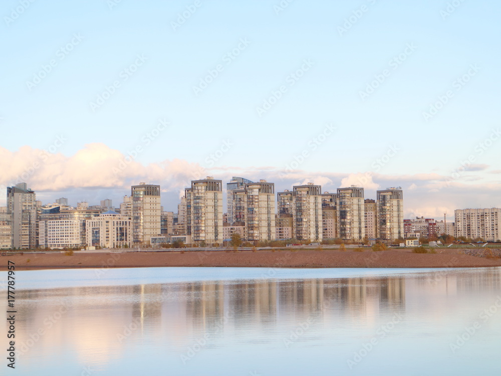 Obraz premium Urban blocks high-rise buildings on the beach at sunset