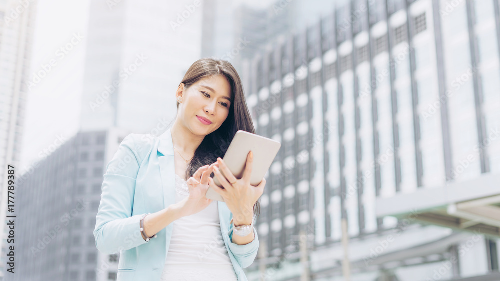 lifestyle business woman feel happy using smartphone, urban city background , business concept lifestyle business woman feel happy using smartphone, urban city background , business concept