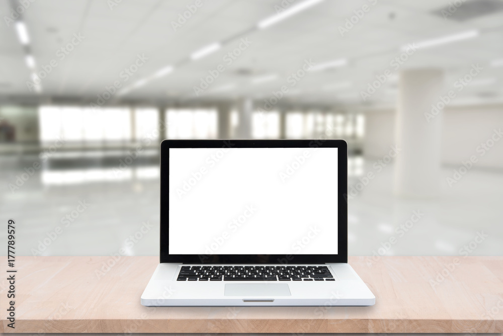 Blank screen computer laptop on wood table on blurred abstract hallway background. can be used for display or montage your product. Blank screen computer laptop on wood table on blurred abstract hallway background. can be used for display or montage your product.