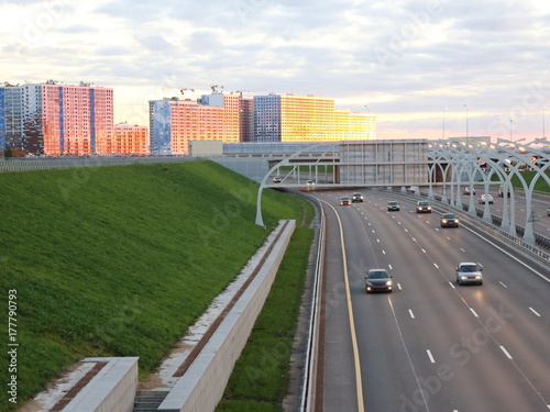 high-speed road at sunset over the sea city