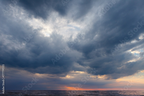 Photography Dark, grey storm clouds above the sea.