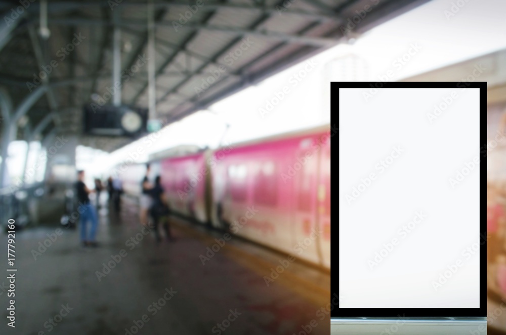 Fototapeta mock up of blank advertising light box or showcase billboard for your text message or media and content with people waiting sky train at train station, commercial, marketing and advertising concept