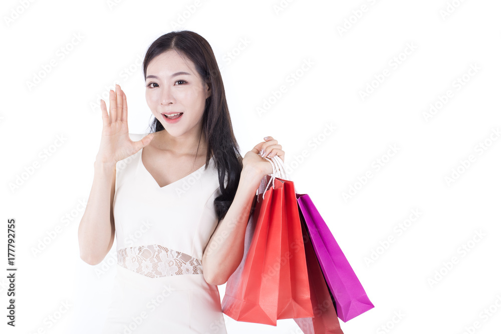 Portrait of Korean Woman Holding Shopping Bag with Happy Emotion, Woman Shopping Concept. Isolated on white background. Portrait of Korean Woman Holding Shopping Bag with Happy Emotion, Woman Shopping Concept. Isolated on white background.