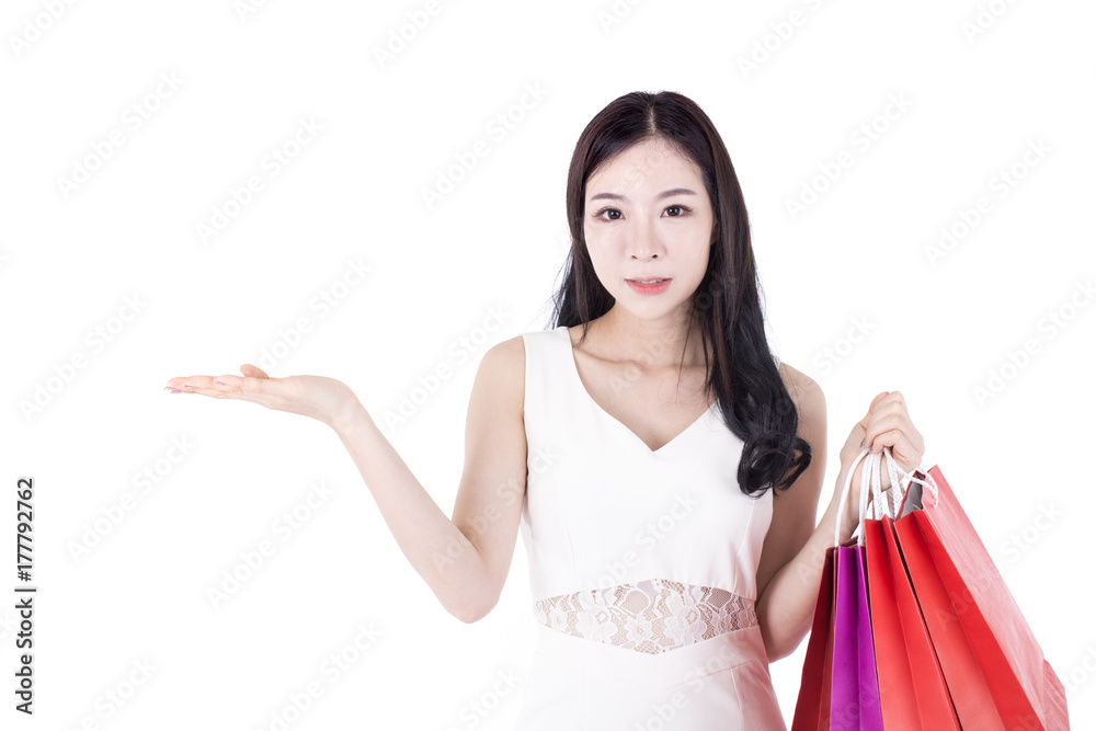 Portrait of Korean Woman Holding Shopping Bag with Happy Emotion, Woman Shopping Concept. Isolated on white background. Portrait of Korean Woman Holding Shopping Bag with Happy Emotion, Woman Shopping Concept. Isolated on white background.