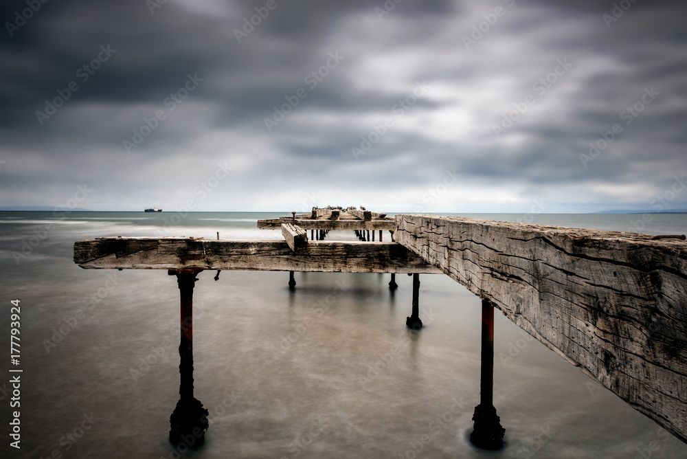 Long exposure of the Costanera in Punta Arenas, Chile, an abandoned dock and pier