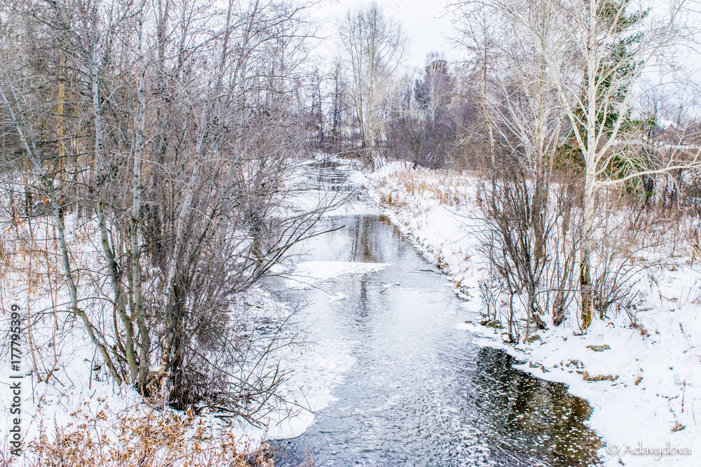 Winter small river in a forest landscape, The Urals, Russia