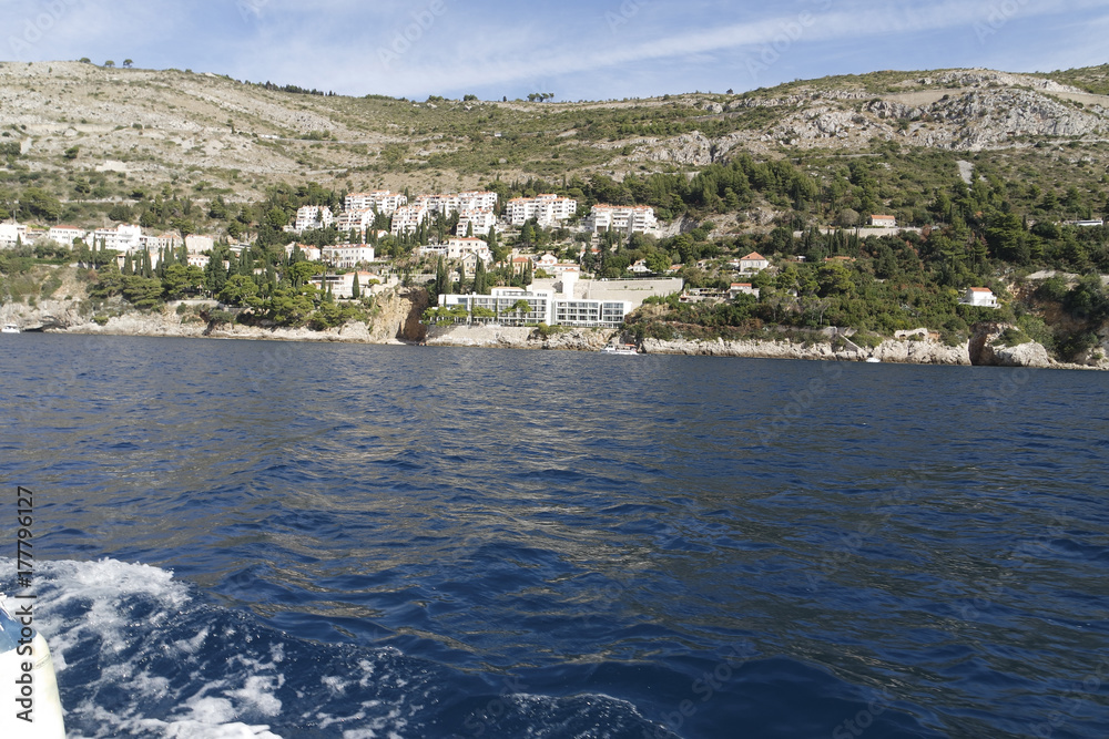 wild coast of croatian town dubrovnik from a boat