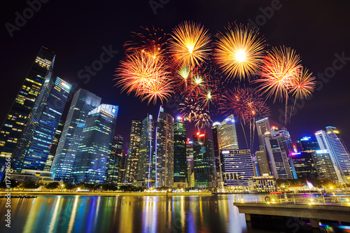 firework over central business district building of Singapore city at night © geargodz