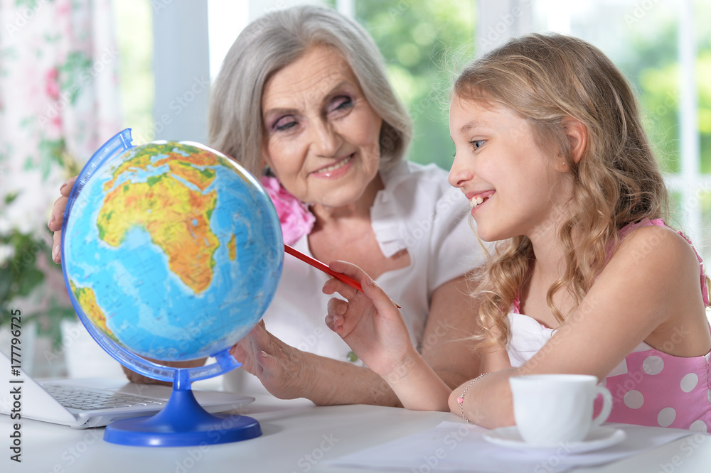 grandmother and granddaughter doing homework grandmother and granddaughter doing homework