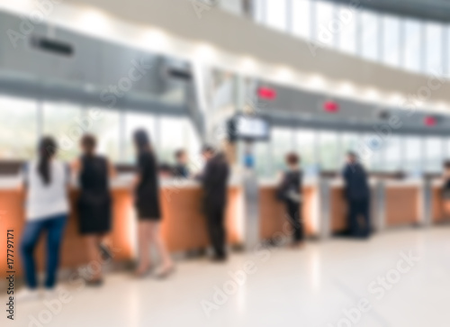 Blurred customer transaction in bank counter photo