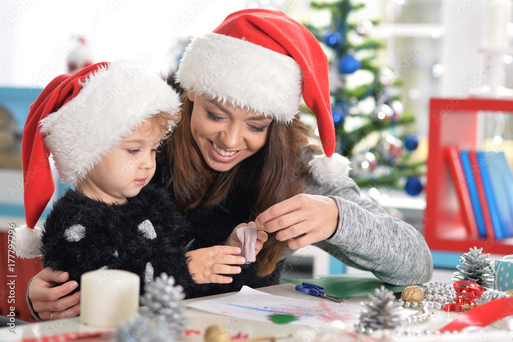 Mother and daughter preparing for Christmas Mother and daughter preparing for Christmas