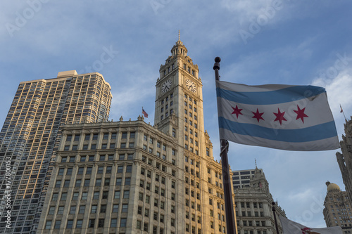 Wrigley building in downtown Chicago with city flag photo