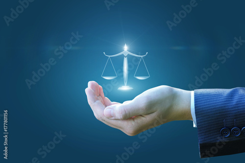 In the lawyer's hand, scales.