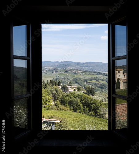 View through a window to the vineyards in Tuscany in Italy