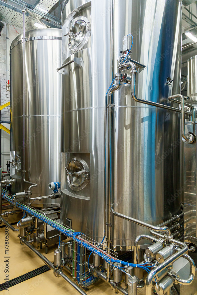 equipment for beer production, private brewery, Contemporary large steel barrels in winery, food industry