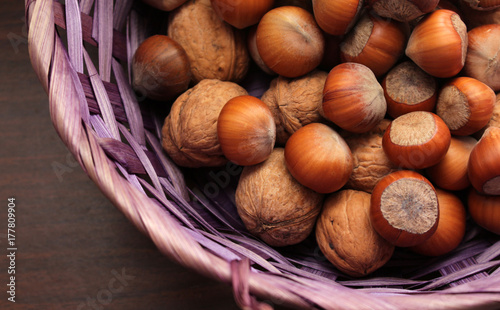 Basket achievement in different types of nuts in-shell hazelnuts and walnuts. photo