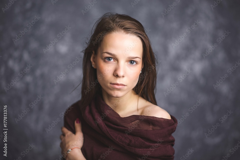 Portrait of a young brunette with sad and serious Portrait of a young brunette with sad and serious