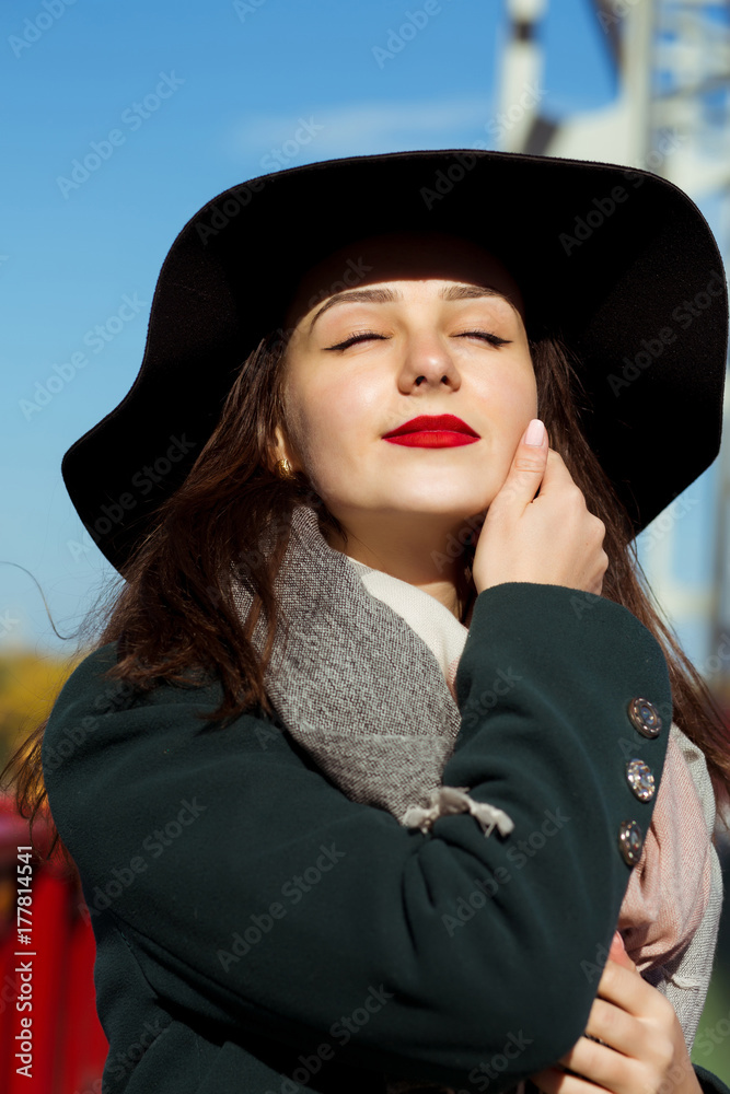 Street portrait of attractive brunette model with closed eyes Street portrait of attractive brunette model with closed eyes