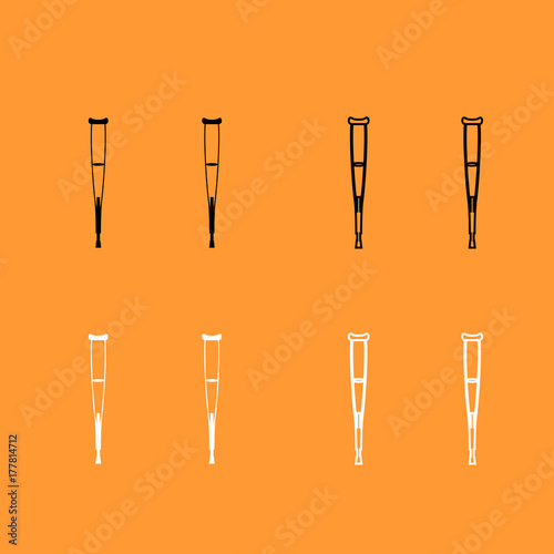 Pair of crutches black and white set icon .
