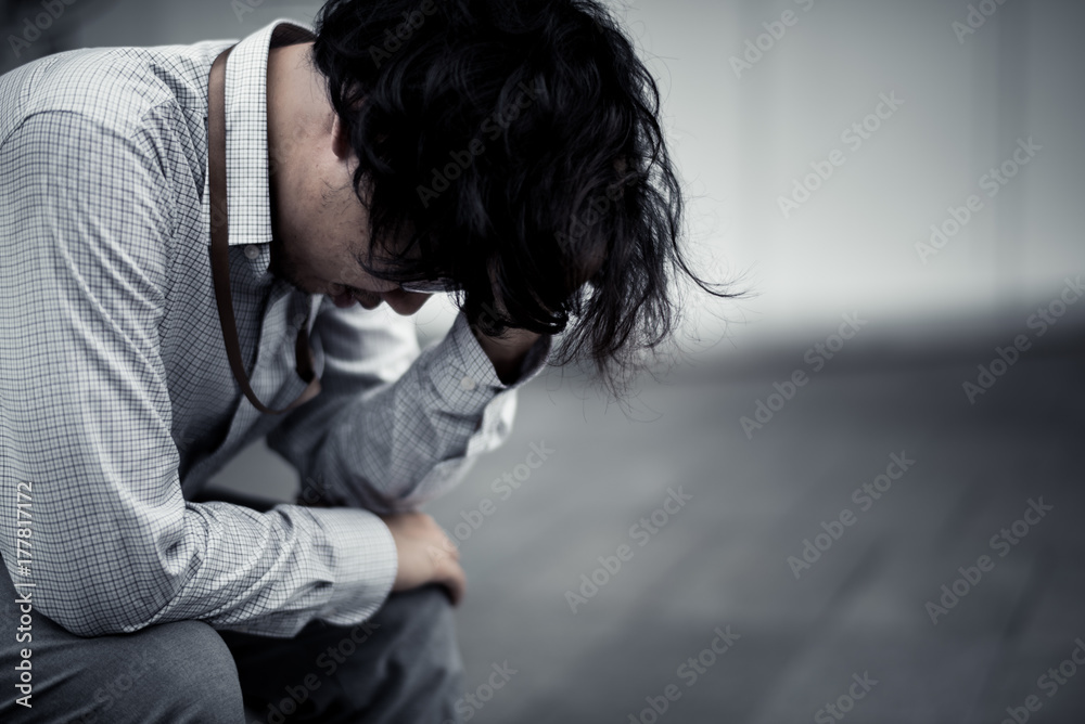business man is stressed from his work. depression and anxiety concept.