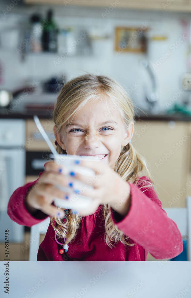 Little girl eating a healthy yoghurt breakfast Little girl eating a healthy yoghurt breakfast