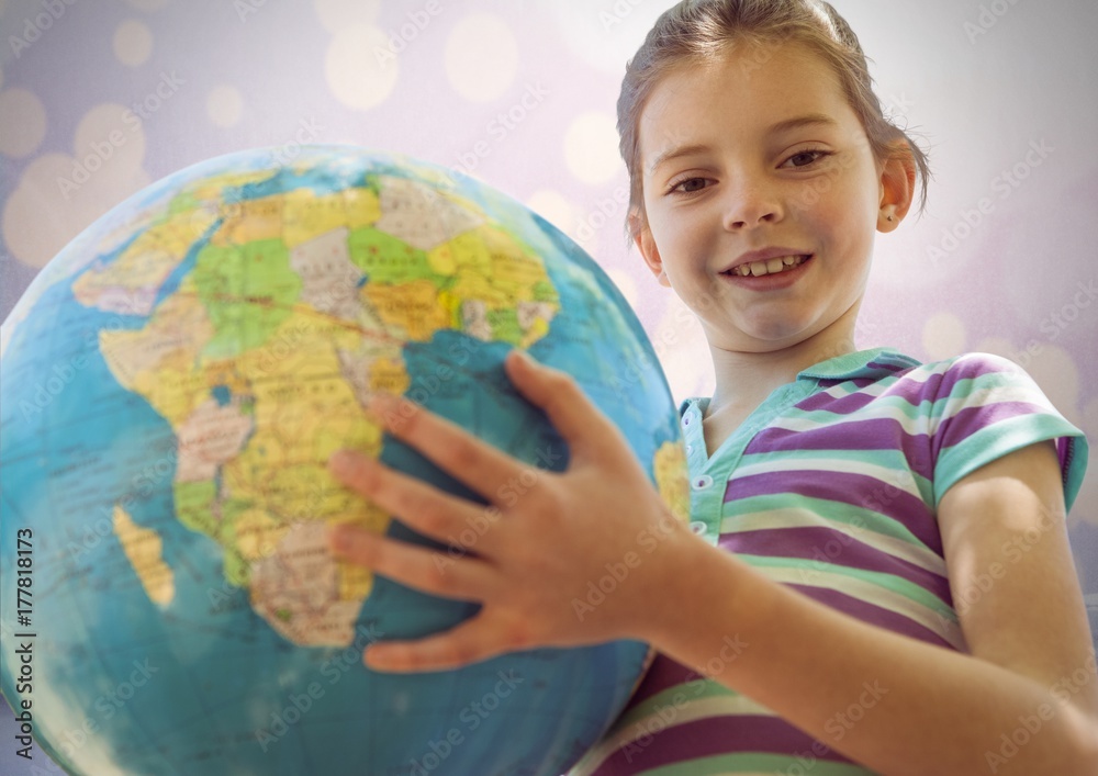 Girl against sparkling background with world globe Girl against sparkling background with world globe
