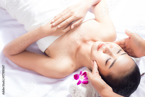 Women are relaxing massage at the spa.