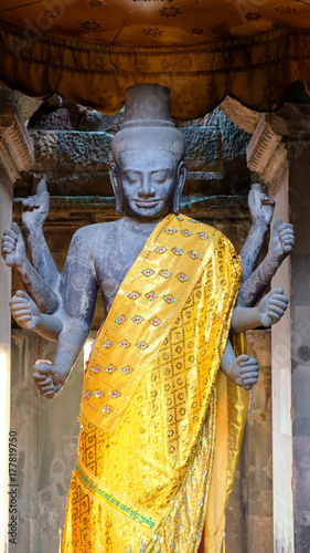 Vishnu Statue wite golden cloth in Angkor Wat Temple, Siem Reap, Cambodia