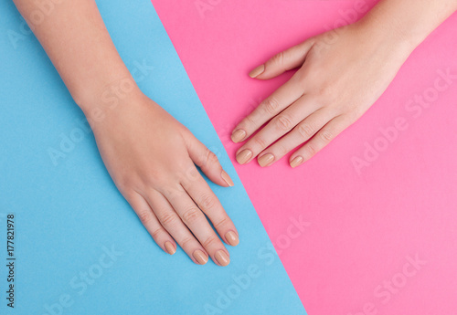 Wallpaper Mural Closeup of hands of a young woman with manicure on nails against pink background Torontodigital.ca