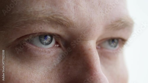 The flag of Europe and America is reflected in the person's eyes