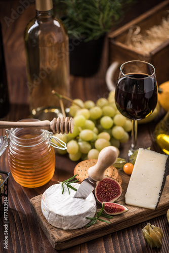 Cheese board with crackers,fig and grapes