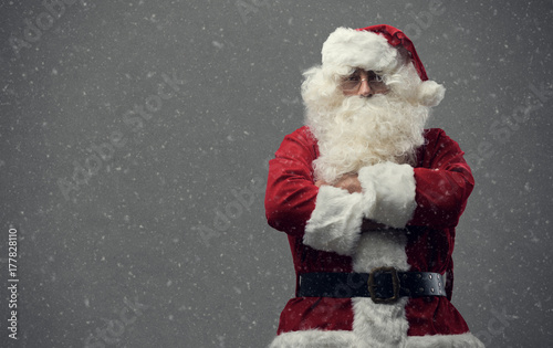 Confident Santa Claus with arms crossed photo