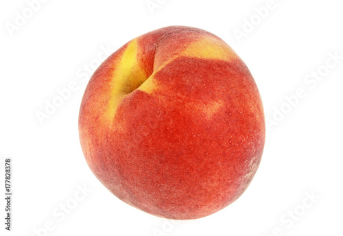 Single peach fruit isolated on a white background