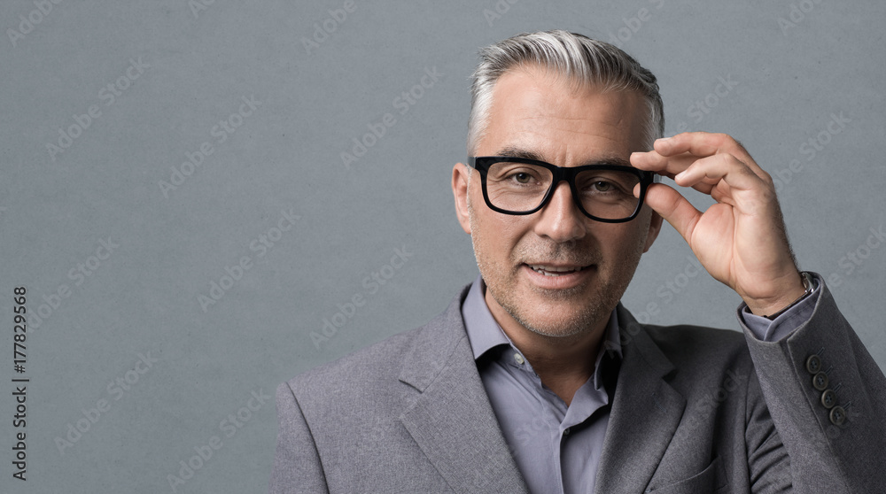 Smart businessman with glasses posing Smart businessman with glasses posing