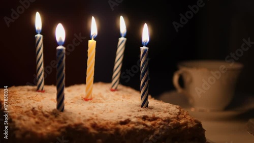 Cake for birthday and burning candles