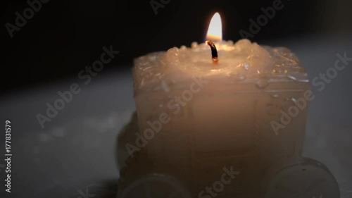 The candle burns on the table