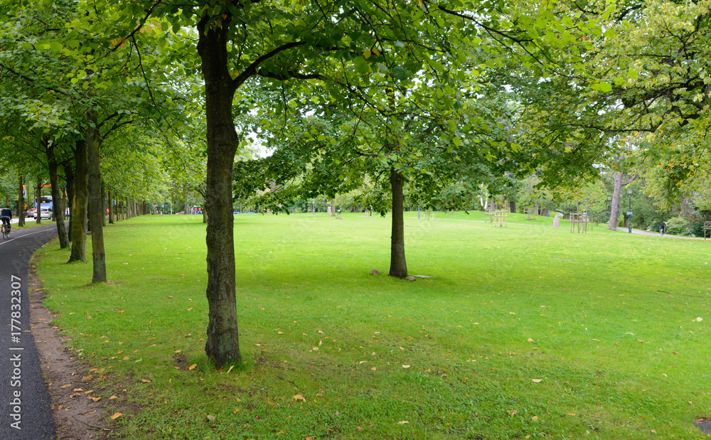 A park in the middle of city with green leaves and well plannned  at gothenburg sweden