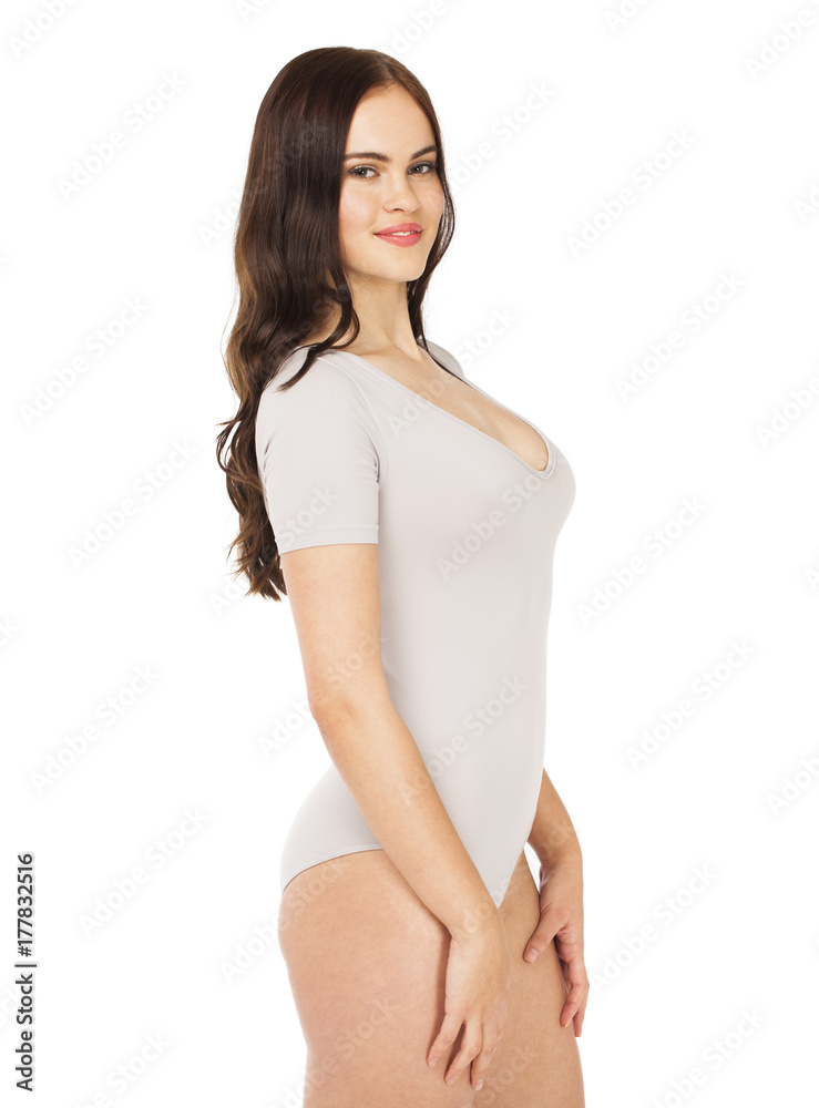 Young beautiful woman in gray fitness body clothing Young beautiful woman in gray fitness body clothing