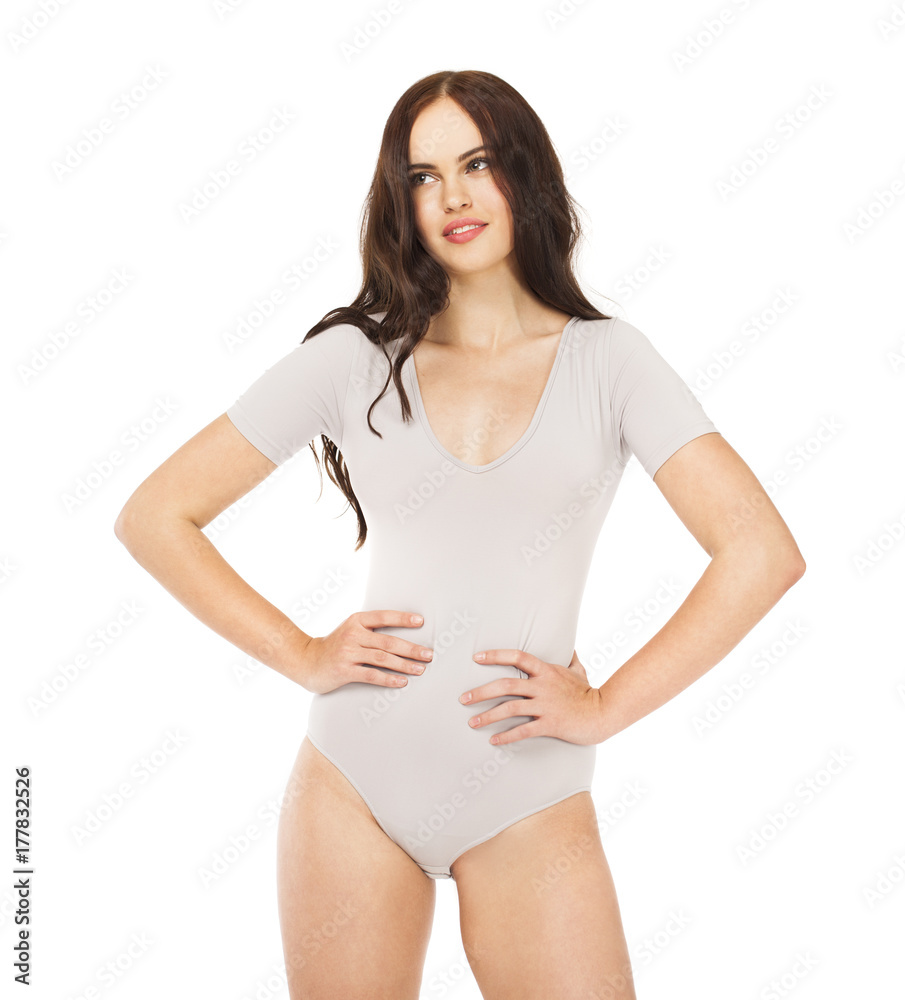 Young beautiful woman in gray fitness body clothing Young beautiful woman in gray fitness body clothing
